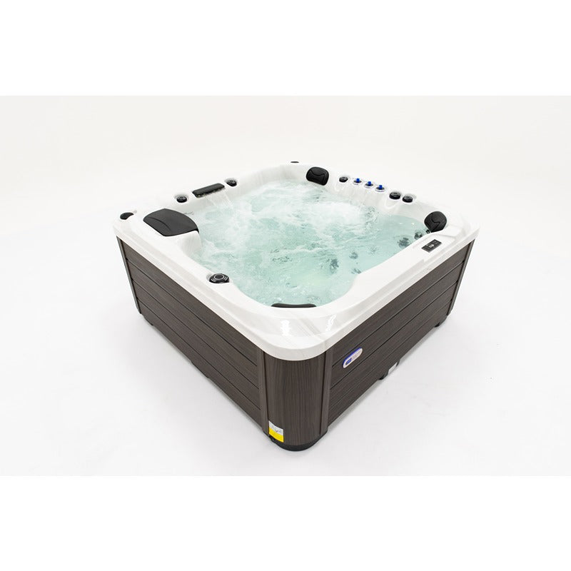 Platinum Spas Palma Hot tub with filled water and running massage function in modern wood-look cladding